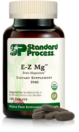 Image of E-Z Mg bottle next to tablets of magnesium supplements.